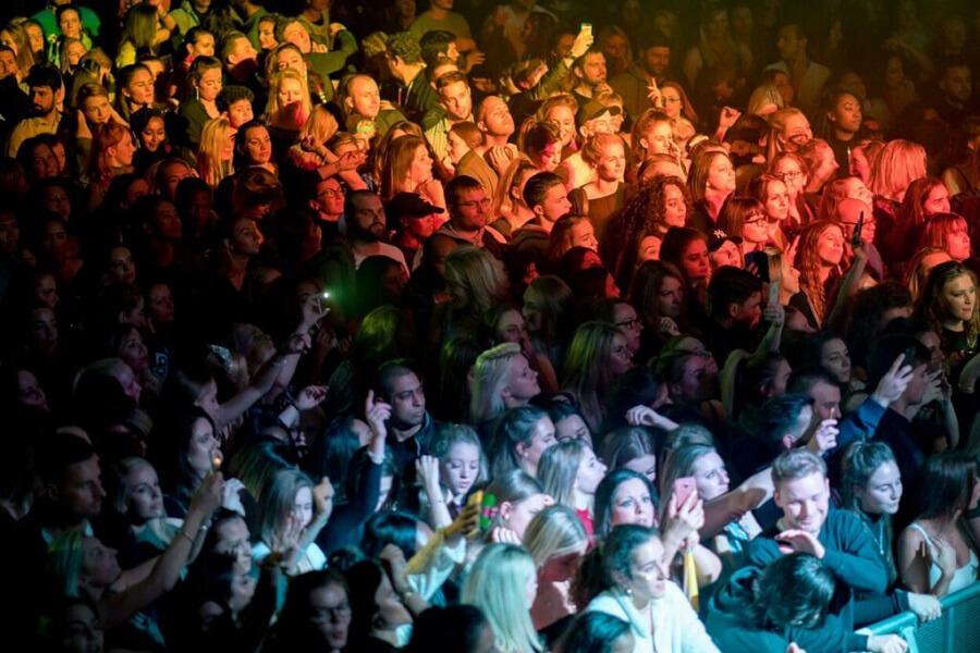 Entry management gates with ticket scanning staff and access control